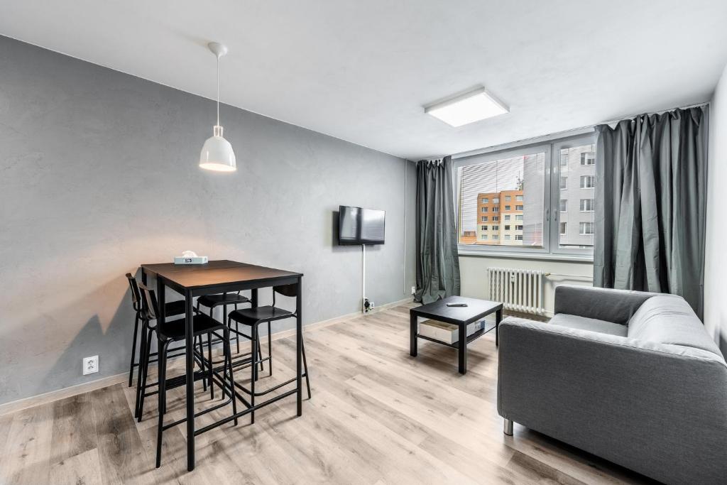Postel nebo postele na pokoji v ubytování Apartments Kolín & Penzion Navara
