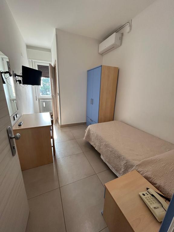 Postel nebo postele na pokoji v ubytování Hotel Marchina