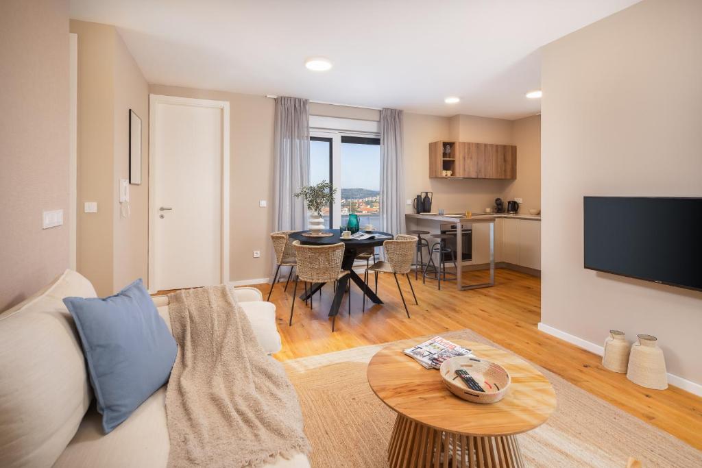 a living room with a couch and a table at ZK luxury apartments in Murter
