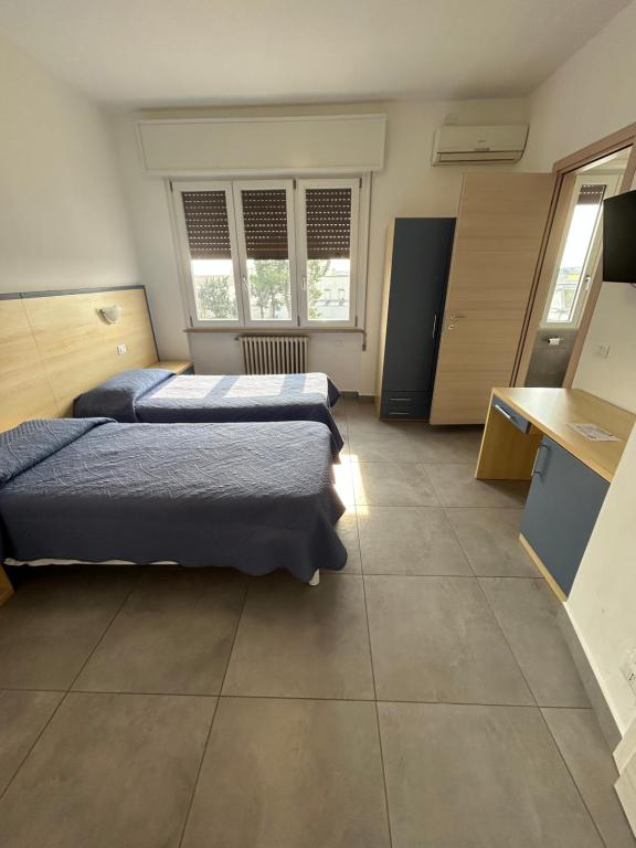 Postel nebo postele na pokoji v ubytování Hotel Marchina