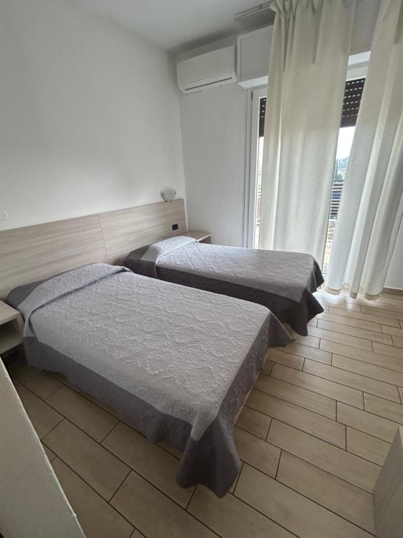 Postel nebo postele na pokoji v ubytování Hotel Marchina