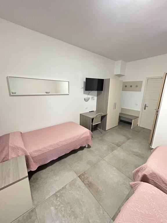 Postel nebo postele na pokoji v ubytování Hotel Marchina