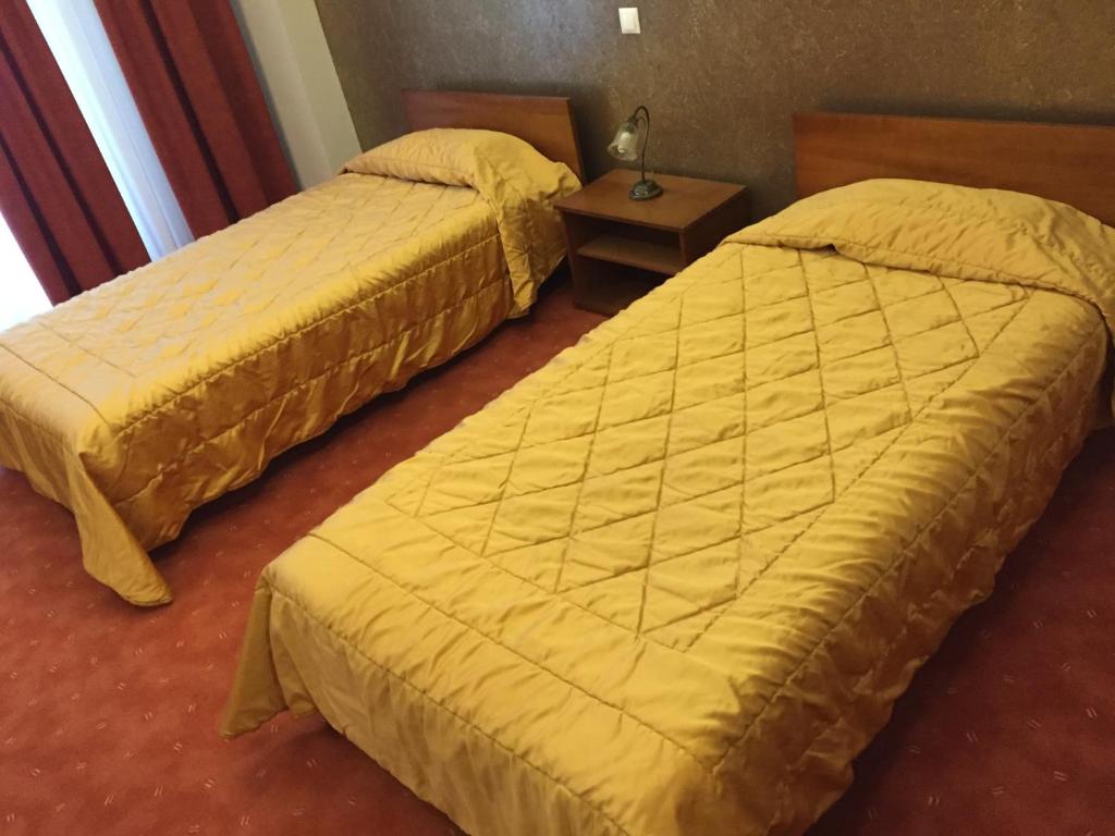 Postel nebo postele na pokoji v ubytování Achillio Hotel