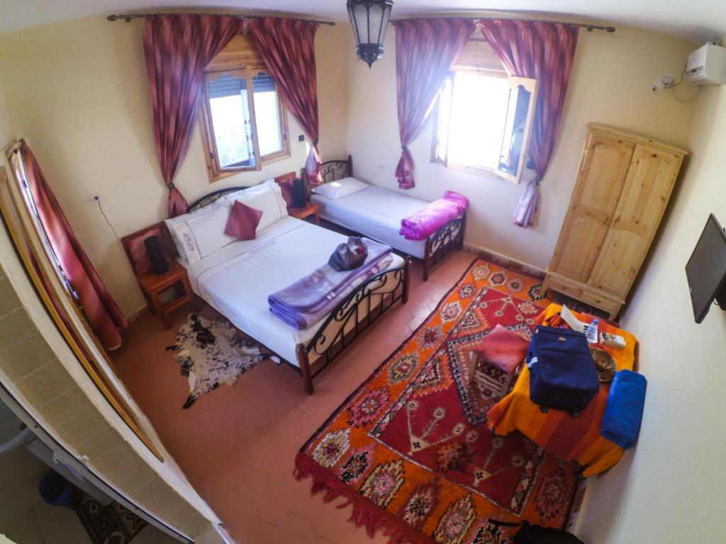 Postel nebo postele na pokoji v ubytování Maison Tigmi Ozro