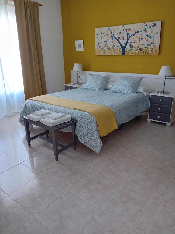 Postel nebo postele na pokoji v ubytování Villas Reina