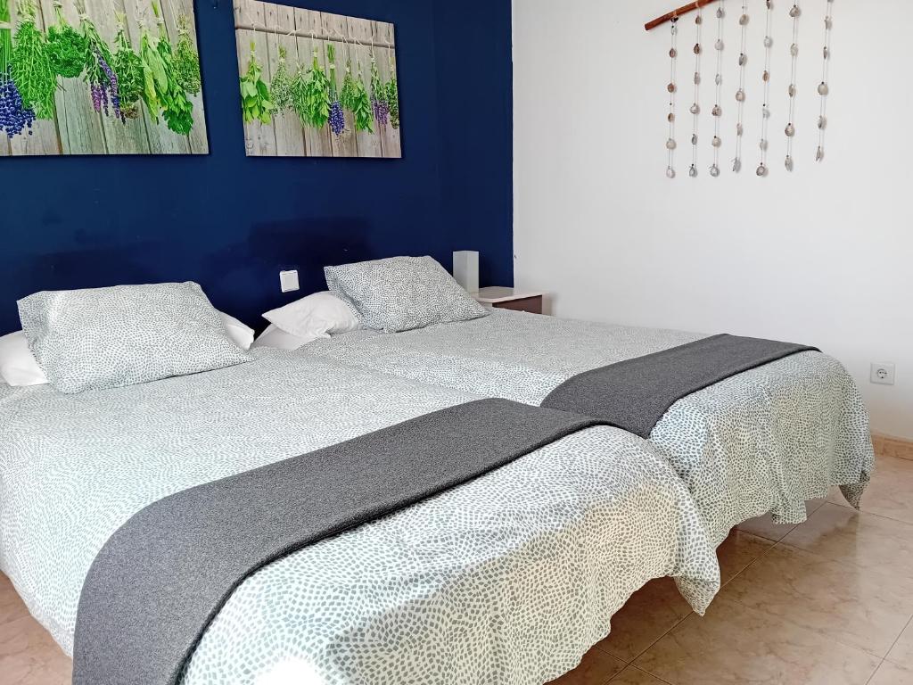 Postel nebo postele na pokoji v ubytování Villas Reina