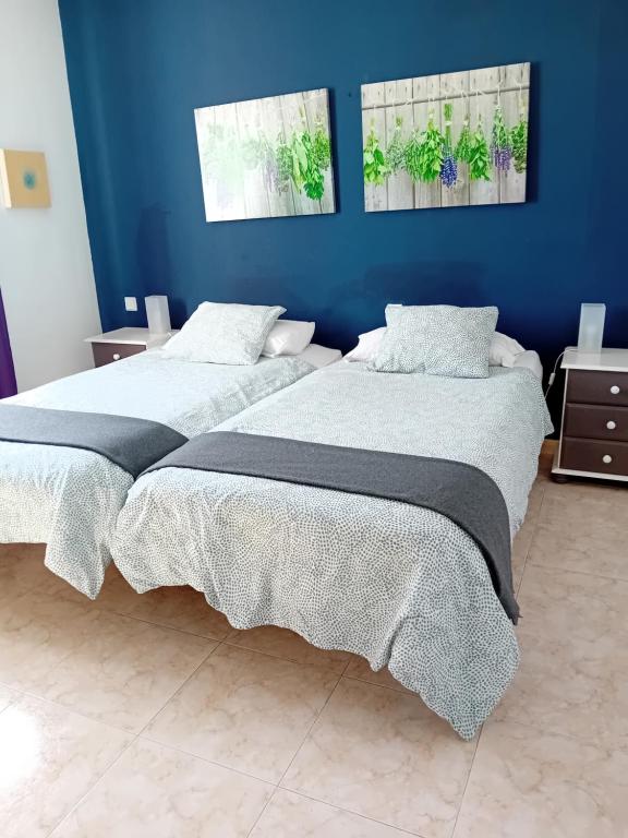 Postel nebo postele na pokoji v ubytování Villas Reina