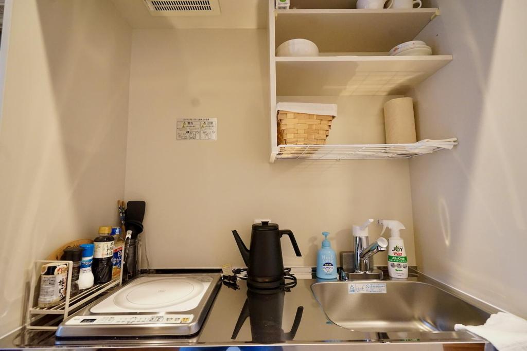 Kuchyň nebo kuchyňský kout v ubytování 遥華-Haruka House