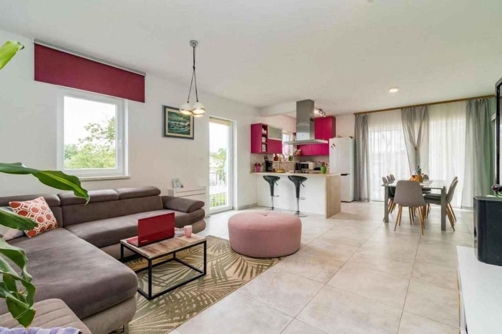 a large living room with a couch and a table at Holiday home in Jakovici - Istrien 53392 in Bašići