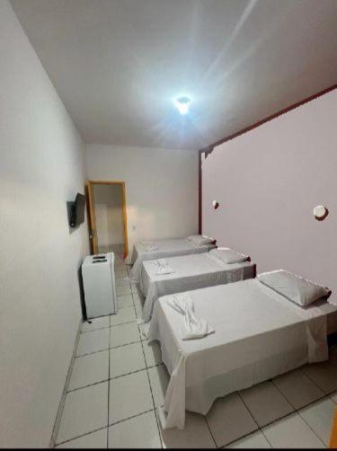 Postel nebo postele na pokoji v ubytování Pousada e Restaurante Kaizen