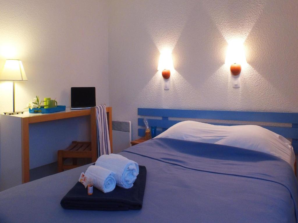 Postel nebo postele na pokoji v ubytování Ars-en-Ré - Apt