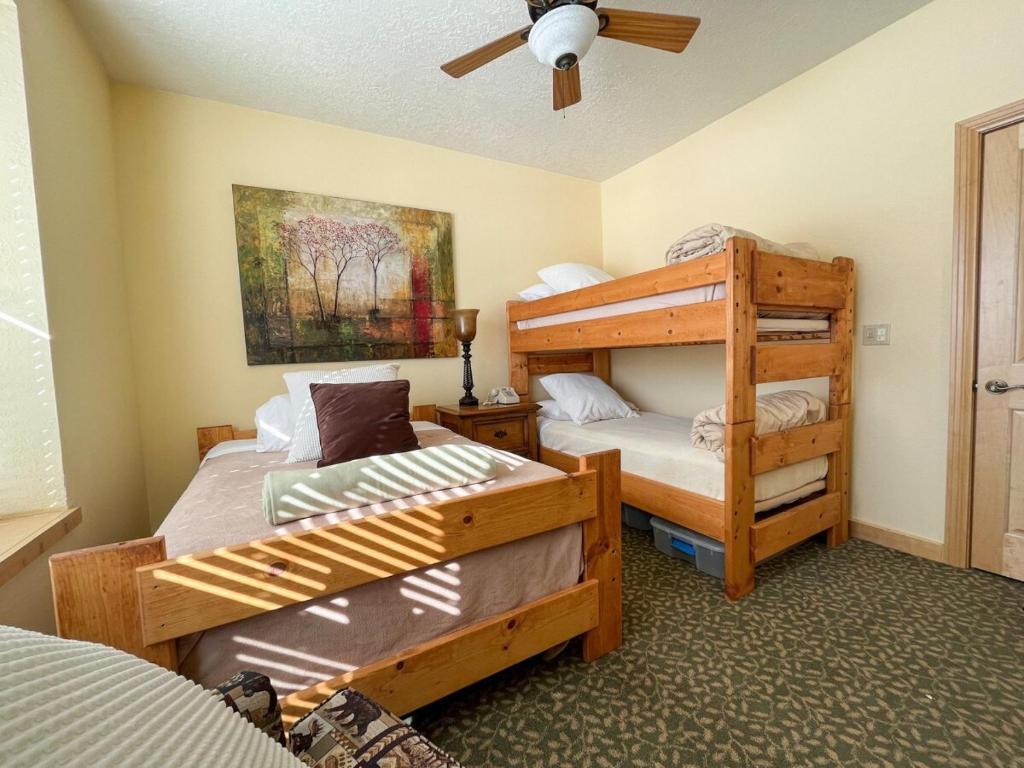 a bedroom with two bunk beds and a ladder at 1BR 1BA for 5 Close to Outdoor Activities in Brian Head