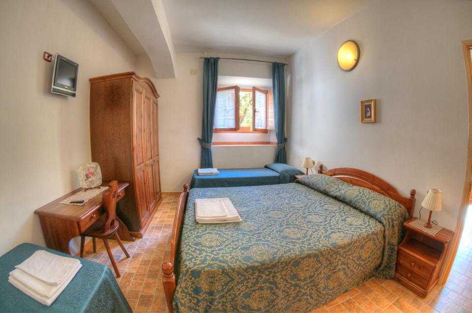 Postel nebo postele na pokoji v ubytování Appartamenti De Sanctis
