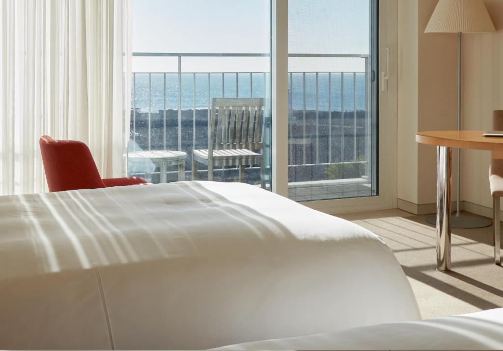 Postel nebo postele na pokoji v ubytování Haevichi Hotel & Resort Jeju