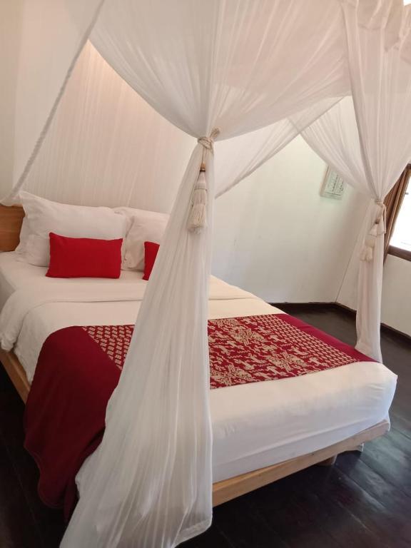 Postel nebo postele na pokoji v ubytování Rua Beach Resort Sumba