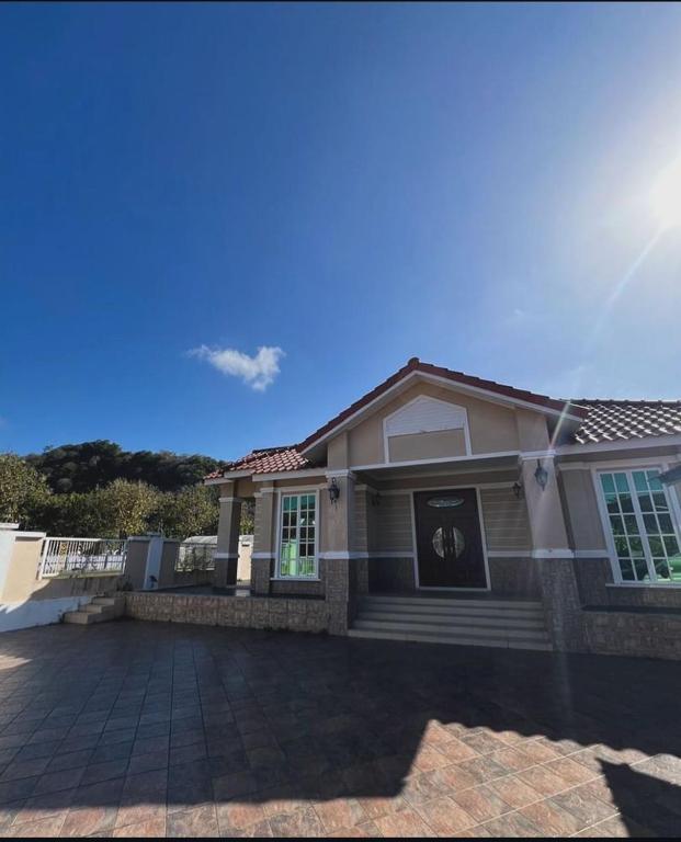 a house with a driveway in front of it at D'Kiara Villa in Kangar