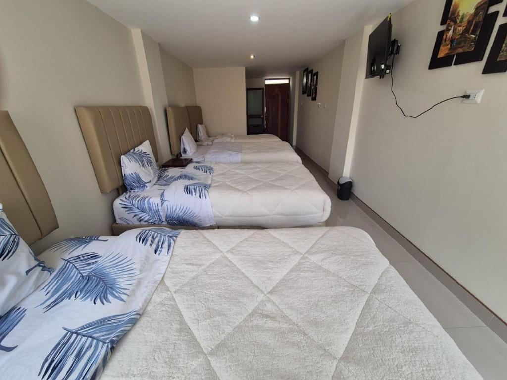 Rúm í herbergi á Hotel Valle Andino