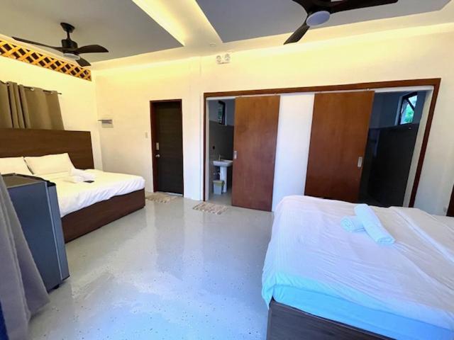 Postel nebo postele na pokoji v ubytování Lulinghayaw Resort-Panglao