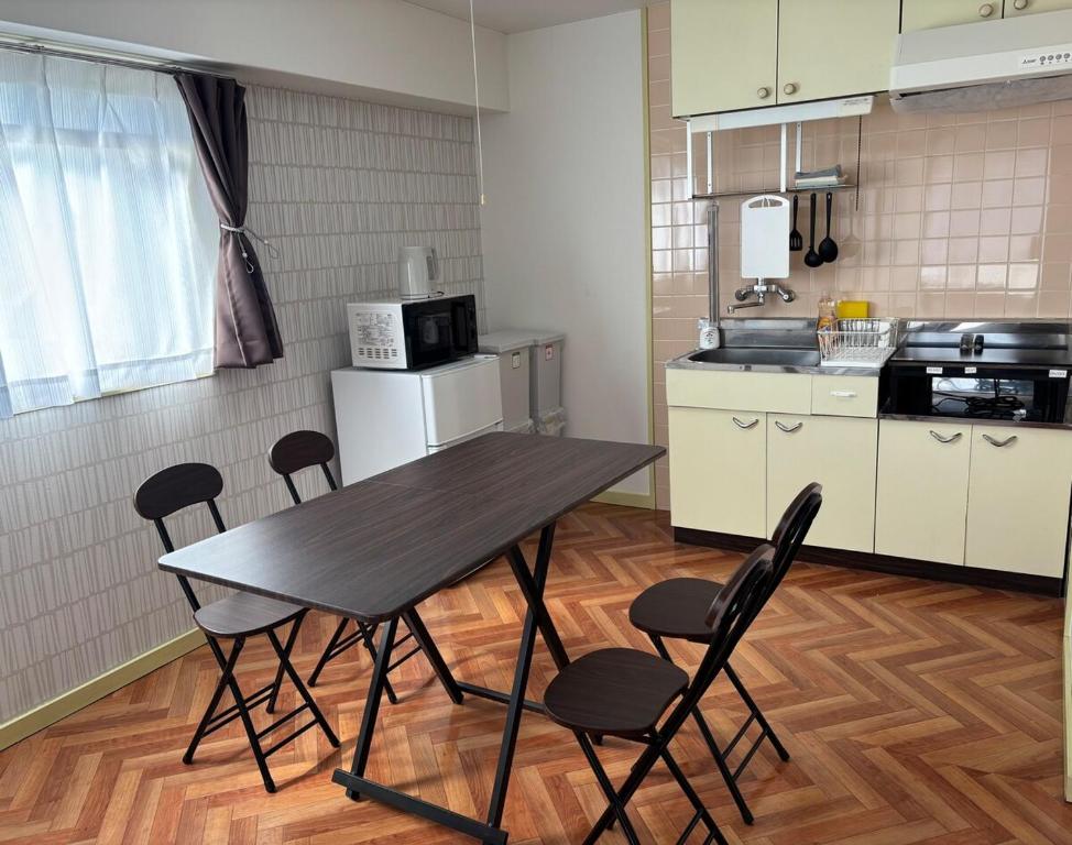 Η κουζίνα ή μικρή κουζίνα στο Orange Stay Matsuyama