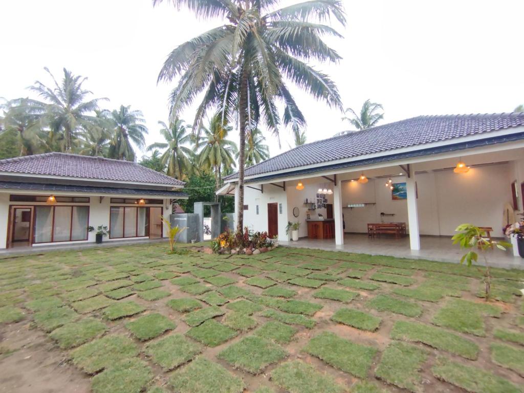 Zahrada ubytování Walur Surf Villa II