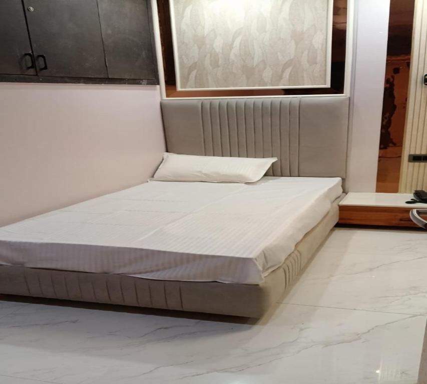 Postel nebo postele na pokoji v ubytování Hotel Spring Vilas