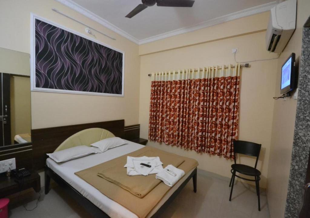 Postel nebo postele na pokoji v ubytování Hotel Yogiraj