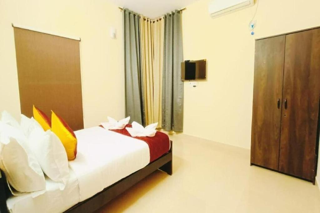 Postel nebo postele na pokoji v ubytování Neighbour Inn - Apart Hotel