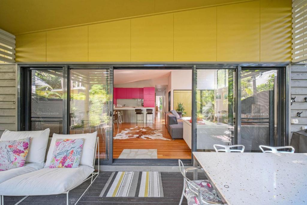a living room with a couch and a table at Bessou in Charlotte Bay