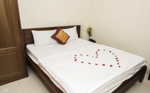 Postel nebo postele na pokoji v ubytování Smile hotel
