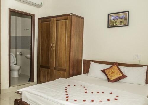 Postel nebo postele na pokoji v ubytování Smile hotel