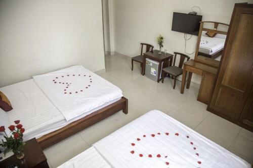 Postel nebo postele na pokoji v ubytování Smile hotel