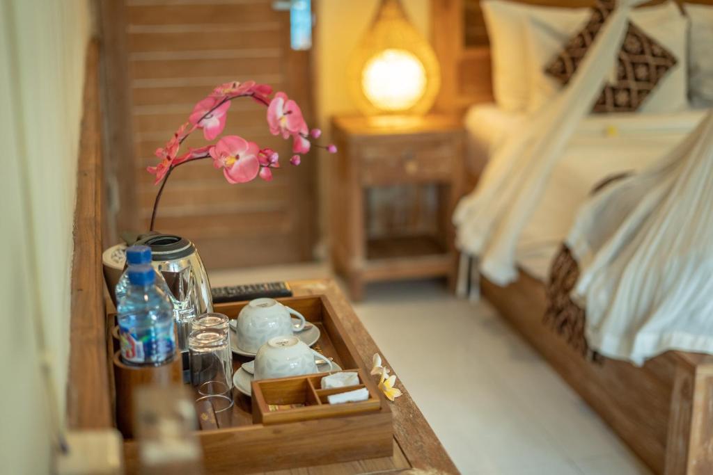 Postel nebo postele na pokoji v ubytování Abhirama Villas and Spa
