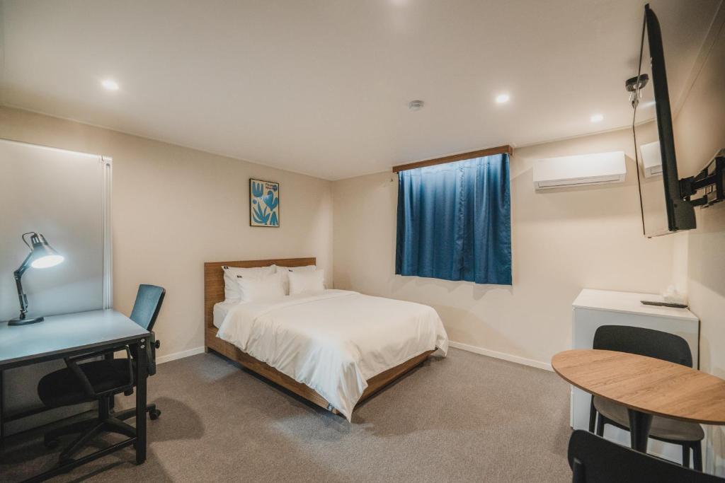 Postel nebo postele na pokoji v ubytování GOYU Hotel