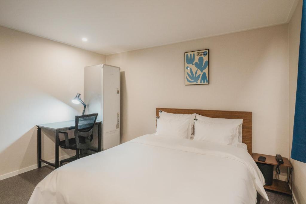 Postel nebo postele na pokoji v ubytování GOYU Hotel