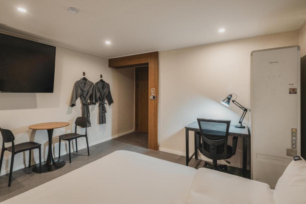 Postel nebo postele na pokoji v ubytování GOYU Hotel