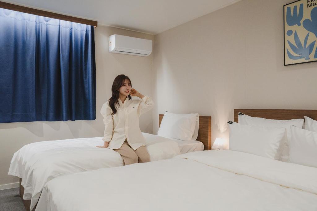 Postel nebo postele na pokoji v ubytování GOYU Hotel