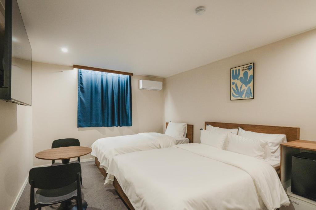 Postel nebo postele na pokoji v ubytování GOYU Hotel