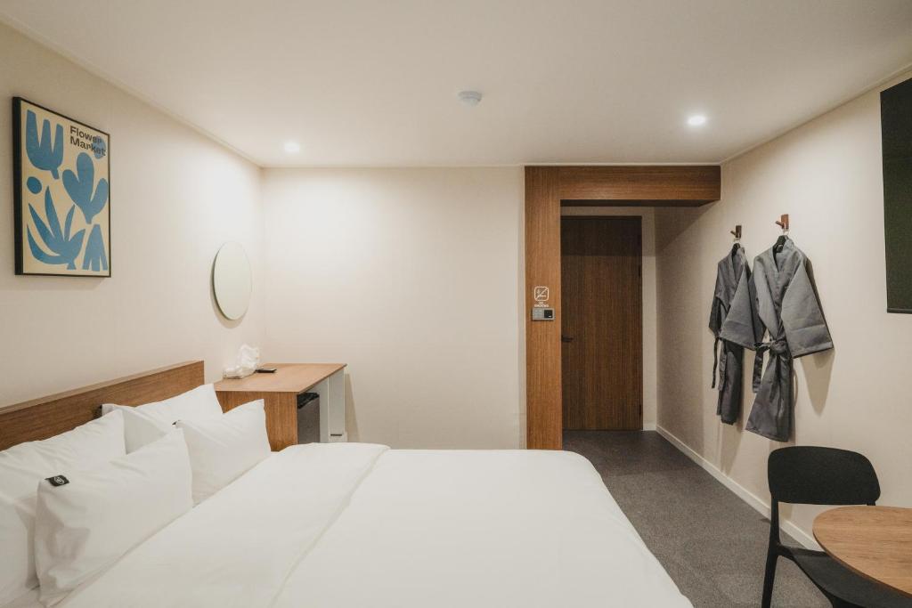 Postel nebo postele na pokoji v ubytování GOYU Hotel