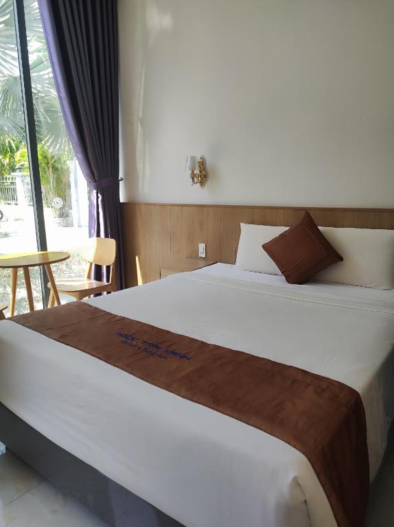 Postel nebo postele na pokoji v ubytování Ngoc Trai Xanh Bungalow