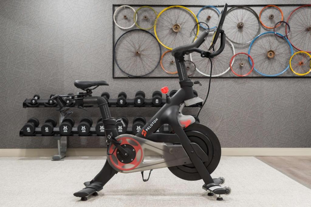 a scooter is parked in a room with bikes at Homewood Suites by Hilton Gateway Hills Nashua in Nashua