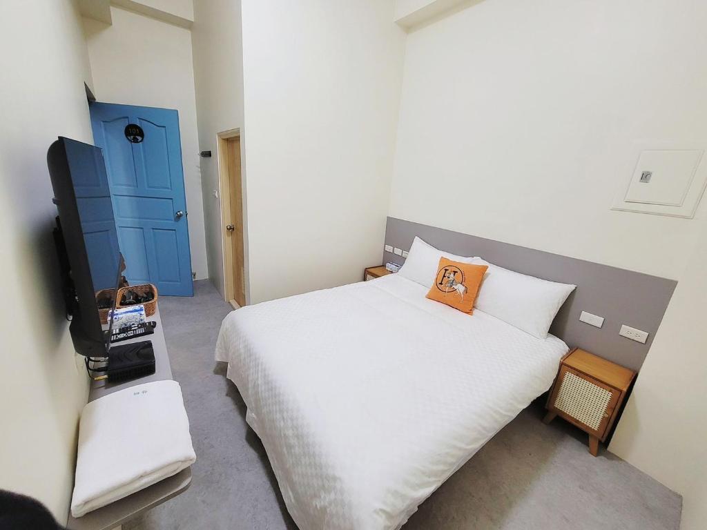 Postel nebo postele na pokoji v ubytování 幸運草輕旅