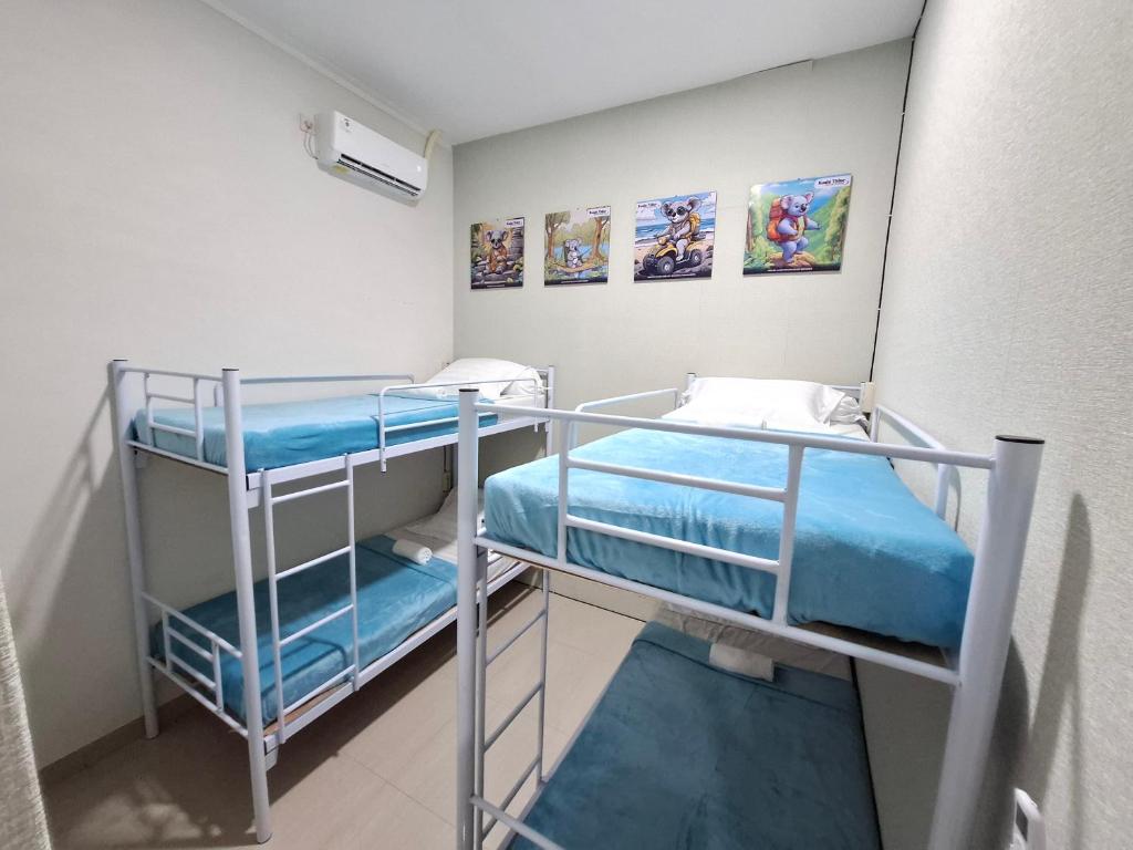 a small room with two bunk beds in it at Koala Tidur Hostel Syariah Yogyakarta in Seturan