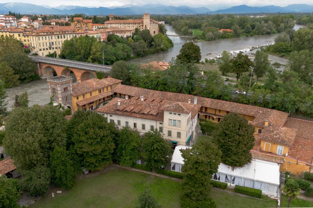 an aerial view of a city with a river and buildings at Hotel Julia in Cassano dʼAdda