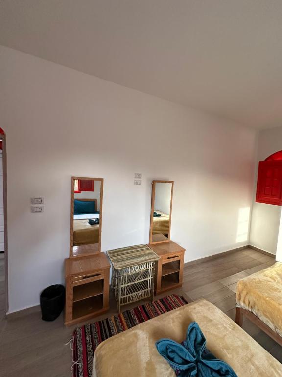 Postel nebo postele na pokoji v ubytování Palm Geust House