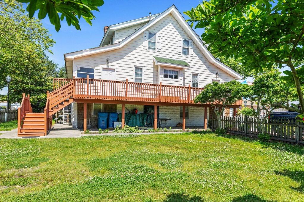 a home with a large deck on a house at OC Downtown Dream Home in Ocean City