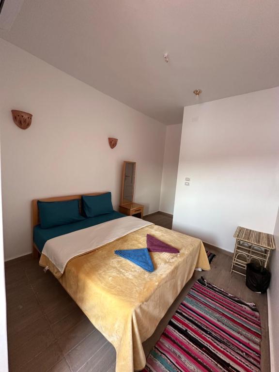 Postel nebo postele na pokoji v ubytování Palm Geust House