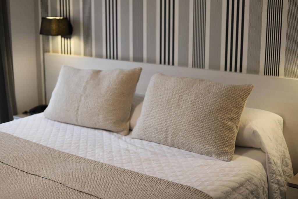 Postel nebo postele na pokoji v ubytování New Hotel Colon