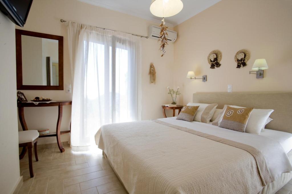 Łóżko lub łóżka w pokoju w obiekcie Kores Villas