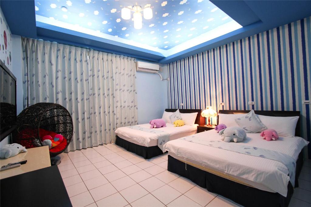 Postel nebo postele na pokoji v ubytování Hualien Dawan B&B