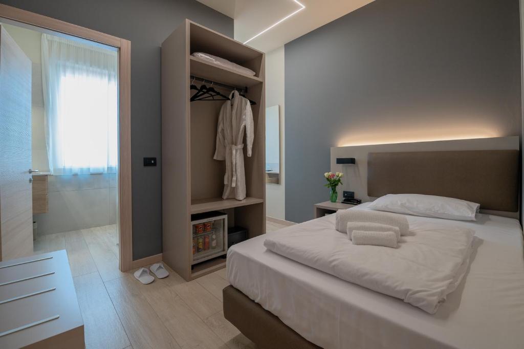 Postel nebo postele na pokoji v ubytování Ile Hotel